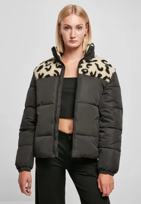 A woman wearing a puffer jacket.