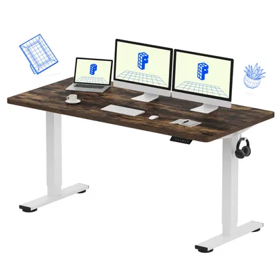 A standing desk with multiple monitors, a laptop, and accessories.