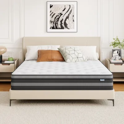 A mattress on a bed in a bedroom setting.