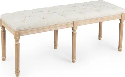 A tufted upholstered bench with wooden legs, shown from a 3/4 angle on a white background.