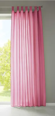 A pink curtain hanging in front of a window.