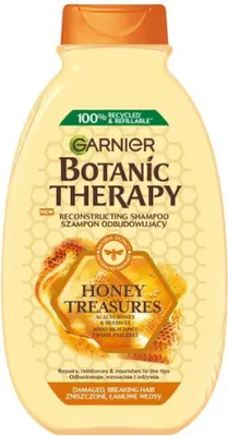 A bottle of Garnier Botanic Therapy shampoo with honey and propolis.