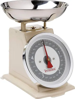 A close-up studio shot of a cream-colored kitchen scale with a silver bowl.