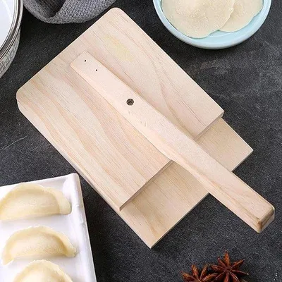 Immagine prodotto di Strumento in legno per pressare la pasta, ideale per preparare wonton e ravioli