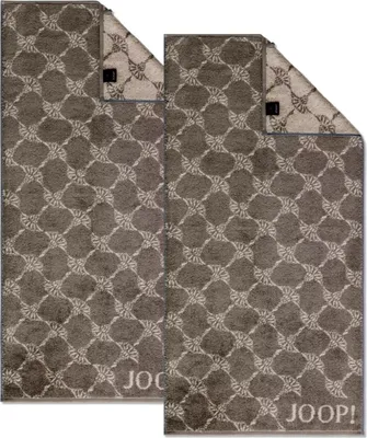 Two towels are laid out on a white background.