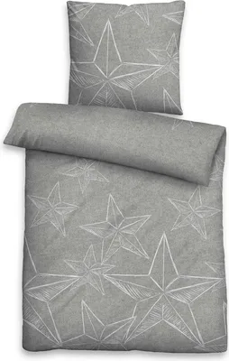 A flat lay of a duvet cover and pillowcase with a star pattern.