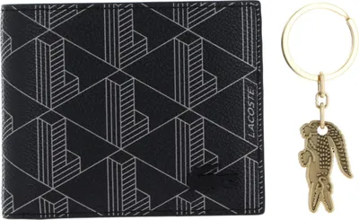 A black wallet with a geometric pattern and a gold keychain with a crocodile charm are displayed side-by-side on a white background.