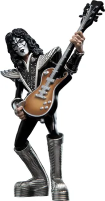 A figurine of a musician in costume holding a guitar.