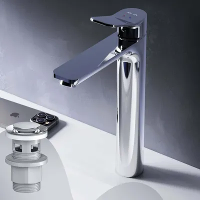 A chrome faucet and pop-up drain are displayed on a white surface, with a smartphone in the background.