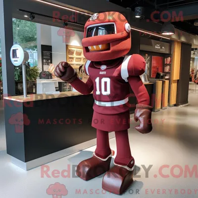 Produktbild von Kastanienbraunes REDBROKOLY Maskottchenkostüm mit American Football-Helm bekleidet mit einem A-Linien-Kleid und Fußpolstern