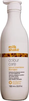A white bottle of Milk_Shake Colour Care Colour Maintainer Shampoo with a pump dispenser.