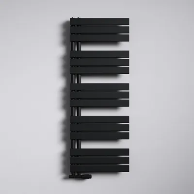 A black radiator mounted on a white wall.