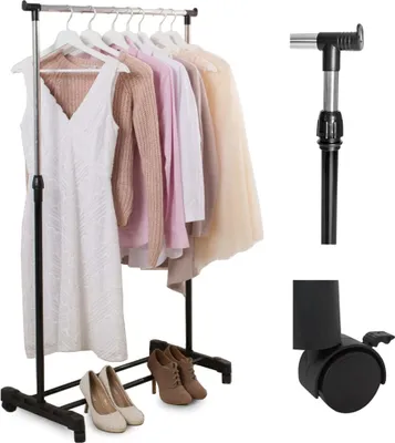 A clothing rack with several garments and a pair of shoes, along with some separate parts of the rack.