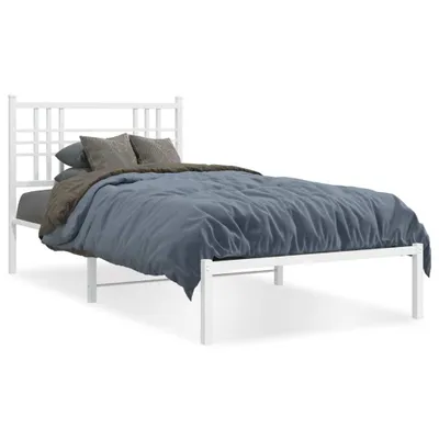 A white metal bed frame with a headboard, dressed with bedding, against a white background.