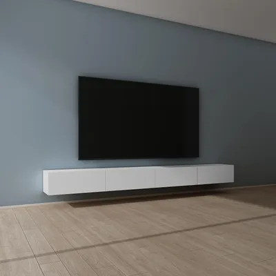 A modern living room with a wall-mounted TV and a white lowboard cabinet.