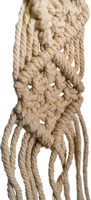 A close-up of macrame knotting.