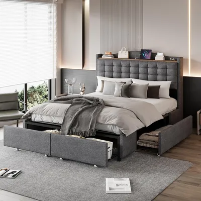A modern bedroom with a bed, storage drawers, and a window.