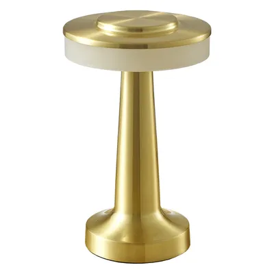 A gold-colored table lamp with a touch sensor on a white background.