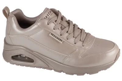 A single beige Skechers sneaker is shown from a side angle against a white background.