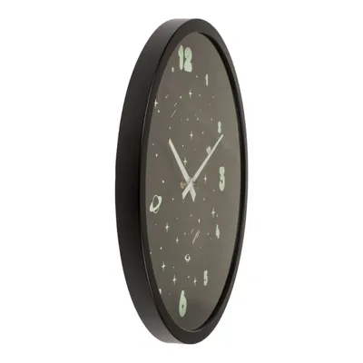 A side view of a round wall clock with a black frame and a dark gray face decorated with stars and planets.