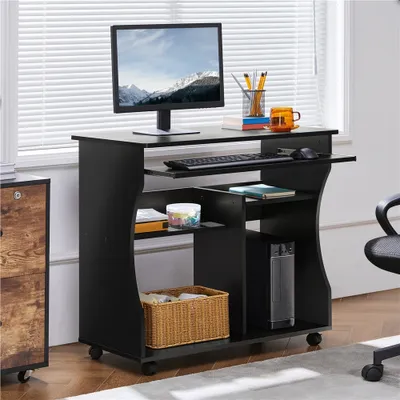 A black computer desk with a monitor, keyboard, mouse, and computer tower, placed near a window with blinds.