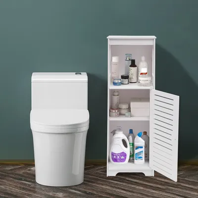 A white toilet and a white storage cabinet are shown in a bathroom setting.