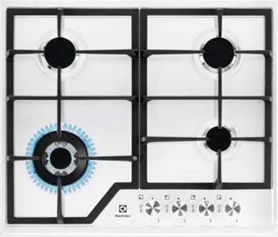 A top-down view of a white gas stovetop with four burners and control knobs.