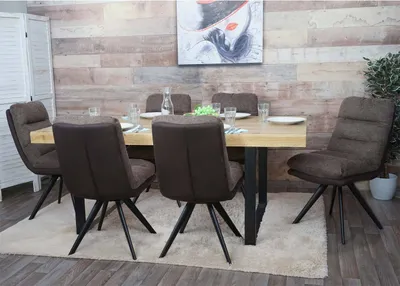 A dining room setting with a table and chairs.