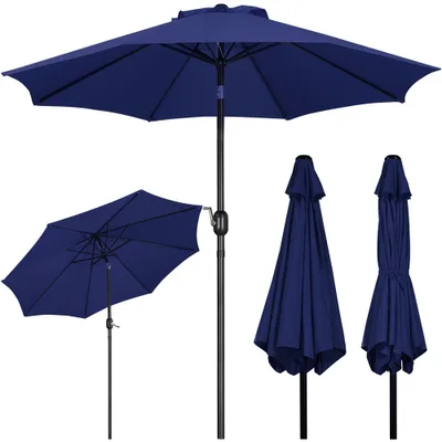 A collection of navy blue patio umbrellas, one fully open and angled, another open and tilted, and two closed.