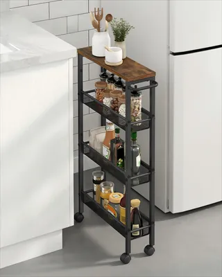 A narrow rolling cart filled with various kitchen items like spices and bottles, placed next to a white cabinet and a refrigerator in a kitchen setting.