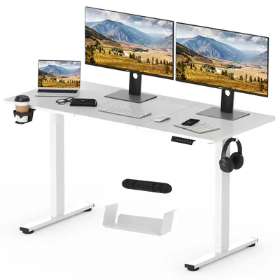 A white adjustable standing desk with multiple computer monitors, a laptop, keyboard, mouse, and headphones.