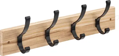 A wooden coat rack with four black metal hooks against a white background.