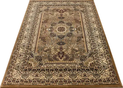 A rectangular rug with an oriental design is shown from a slightly elevated angle against a white background.