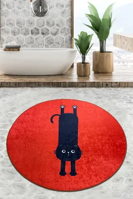 A bathroom scene with a bathtub and plants, featuring a round rug with a cat design in the foreground.