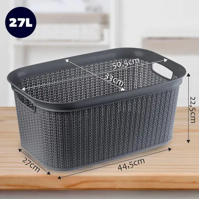 A grey laundry basket with dimensions indicated by text and arrows, placed on a wooden surface.
