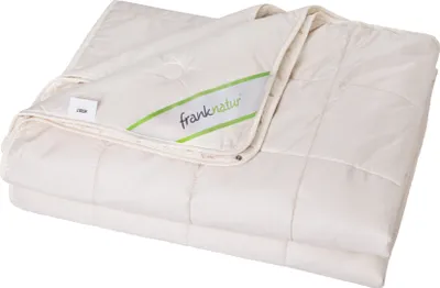 A folded cream-colored duvet is shown on a white background.