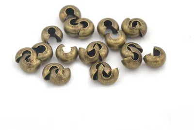 Produktbild von Vintageparts Coverperlen antik Bronze 5 mm, 20 Stück