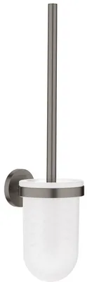 A wall-mounted toilet brush holder with a glass container and a metal handle.