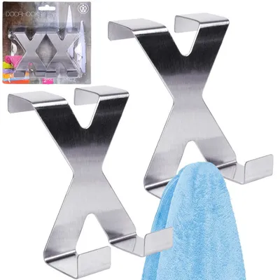 Two metal 'X' shaped door hooks displayed on a white background, with one hook holding a blue towel. Packaging for the product is visible in the top left corner.