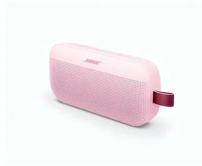 A pink Bose Bluetooth speaker with a burgundy strap.