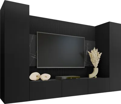 A modern black entertainment center with a wall-mounted television and decorative elements.