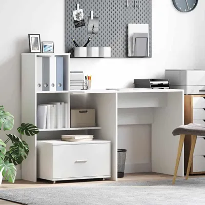 A white desk with shelves and drawers, organized with office supplies and decorative items.