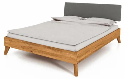 Produktbild von Bett Gerg 4 aus Wildeiche massiv 180x200 cm mit Polsterkopfteil und Holzbeinen
