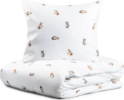 A folded duvet and pillow with a repeating pattern of cats on a white background.