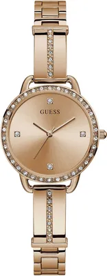 A close-up, studio shot of a rose gold Guess women's watch against a white background.