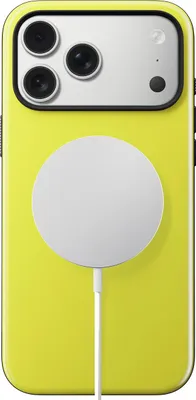 The back of a yellow iPhone case with a white MagSafe charger attached.
