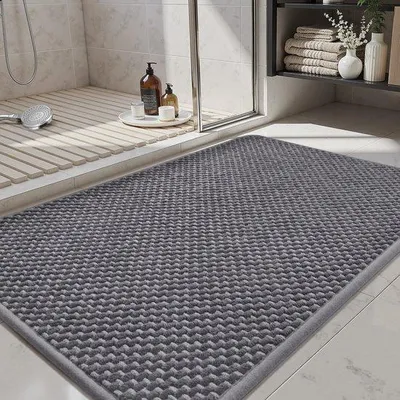 Immagine prodotto di Tappetino da bagno in ciniglia Unyqoos® – assorbente e antiscivolo, 40 x 60 cm, disponibile in grigio scuro e grigio chiaro, ideale per bagno e doccia