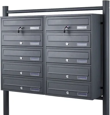 A dark gray, multi-unit mailbox system mounted on a black metal frame.