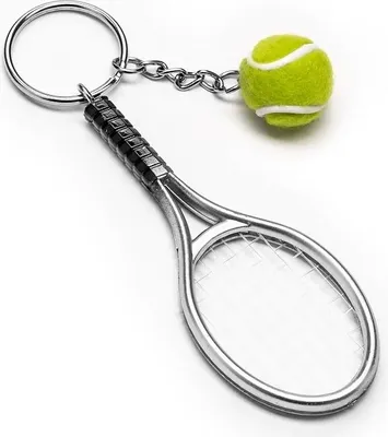 A keychain with a miniature tennis racket and a tennis ball.