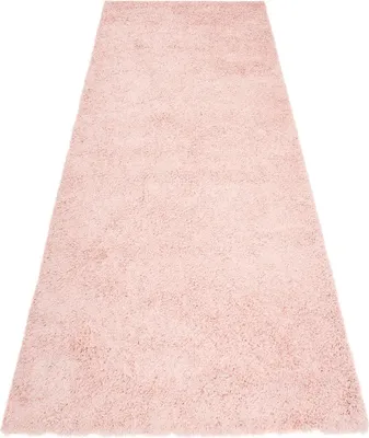 A pink rug is shown from a diagonal angle on a white background.